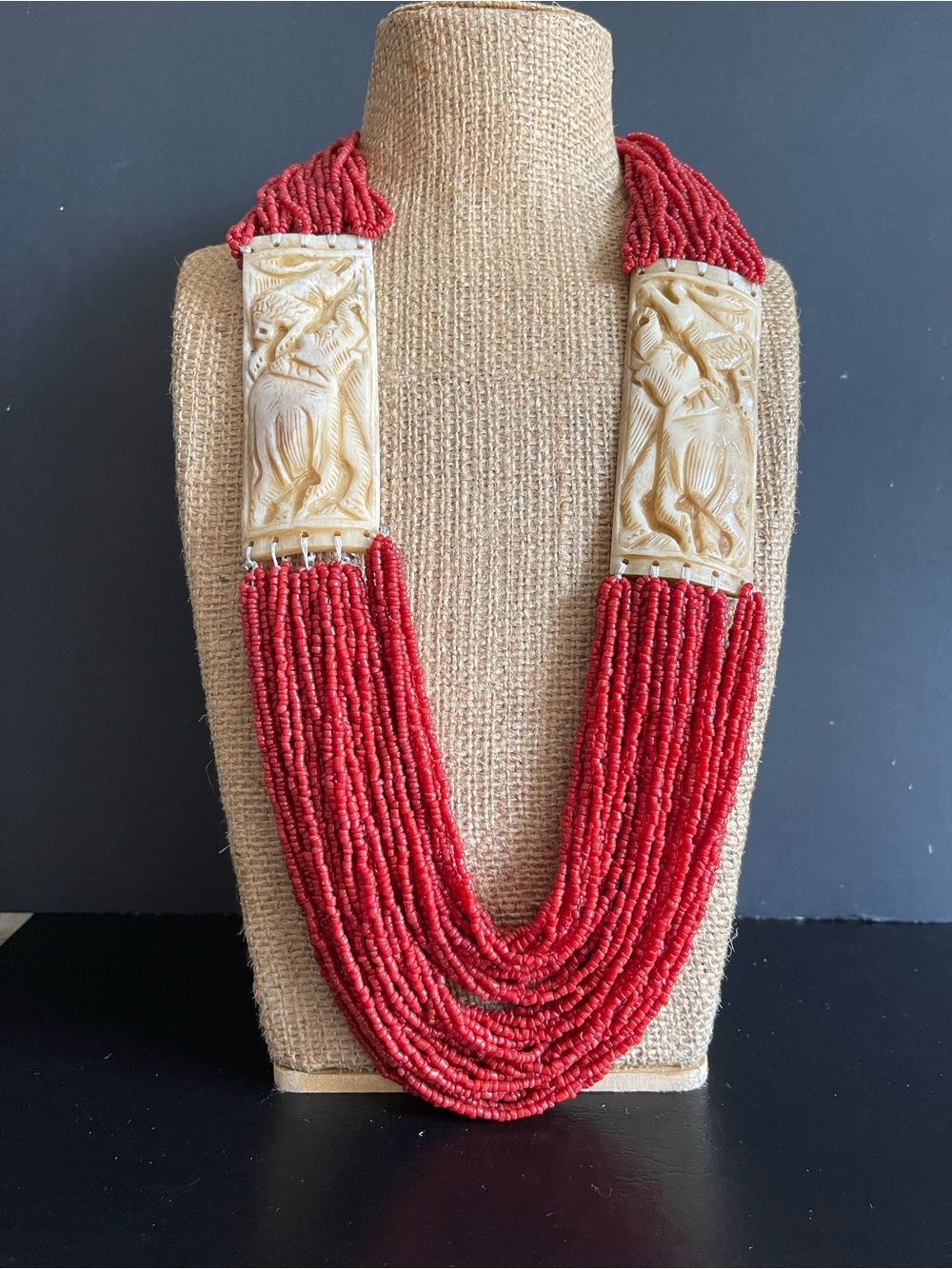 Vintage multi stand genuine red seed coral and Carved bone necklace.